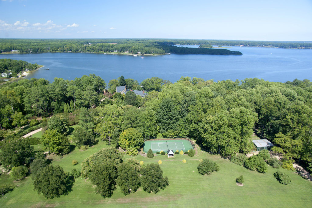 Carousel aerial showing river and tennis courts mls